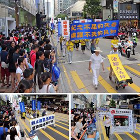 圖6.制止迫害的遊行，吸引廣大民眾和旅客的關心與圍觀，紛紛舉起相機、手機拍照。