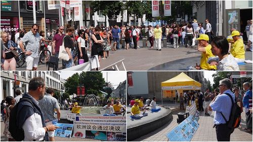 '圖1：在安特衛普梅爾街大法弟子向民眾展示法輪功功法，傳播真善忍的美好，並告知民眾持續十八年的發生在中國的迫害真相，呼籲民眾共同制止迫害。'