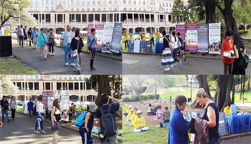 '圖2：法輪功學員在市中心貝爾莫公園（Belmore?Park）的主街上展示法輪功的五套功法和真相展板'