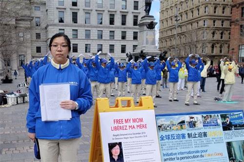 '圖11：法輪功學員Karen在集會上呼籲人們關注，幫助營救因煉法輪功被中共警察綁架的母親。'