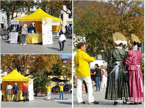 '圖5：在於柏林根（Überlingen），過往的路人看到法輪功學員的真相展位，有不少人對法輪功很感興趣，表示想學法輪功，詢問煉功點訊息；也有不少路人簽名聲援法輪功學員反迫害。與法輪功學員交談的人中，有不少人來自原東德地區的遊客，他們對共產主義體制和其罪惡非常清楚，他們想提醒人們警惕共產主義，並鼓勵學員繼續揭露中共的罪行。'