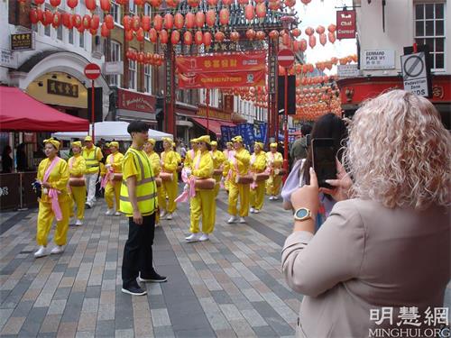 '圖1～6：二零二一年八月二十八日，英國法輪功學員在倫敦市中心舉辦遊行，傳播法輪功的真相，呼籲停止迫害。'